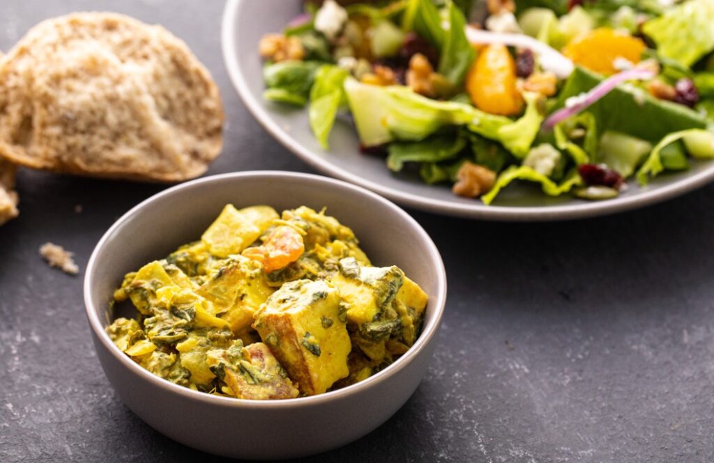 Palak Paneer, Salad, and Rolls from the Deli