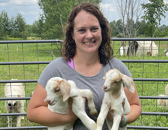 Leslie from Cylon Rolling Acres Holds Two of Her Young Goats