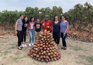 Monica and Family by Pile of Cacao Beans