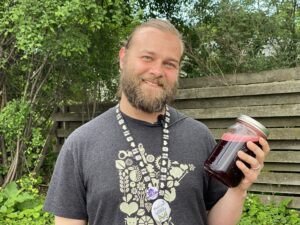 Sampson Holding Jar of DIY Sports Drink Functional Beverage