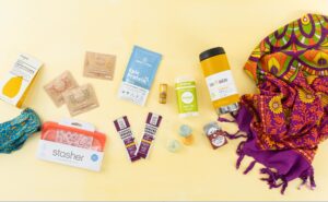 Summer Essentials on a Yellow Background Include Hydration Packets and Protein Powder