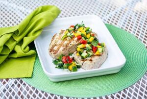 Grilled Tuna Steak with Bright Salsa on a Green Placemat