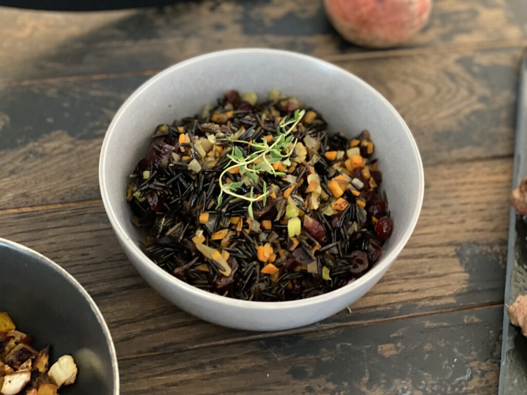 Wild Rice In a Bowl Against a Wood Background