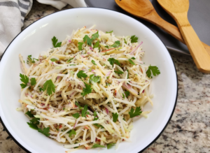 Kohlrabi Apple Slaw Served on a White Plate