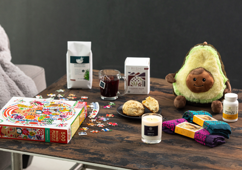 Table With a Puzzle, Tea, Avocado Stuffed Animal, Candles, Bath Salts