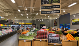 Lakewinds Produce Department with Packages of Berries and Asparagus