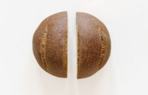A Darker Loaf of Gluten Free Bread Sliced Down the Middle