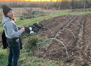 Sadie Standing By Vegetable Rows