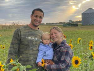 Family Stands On Farmland