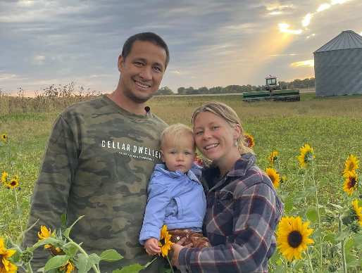 Family Stands On Farmland