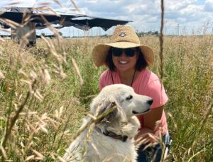 Farmer Wendy in a Field with her Farm Dog