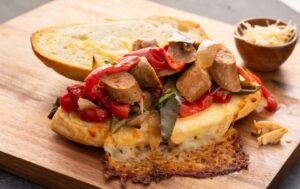 Slow Cooked Sausage and Peppers on a Cheese Hoagie