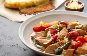 White Bowl with Slow-Cooked Sausage and Peppers