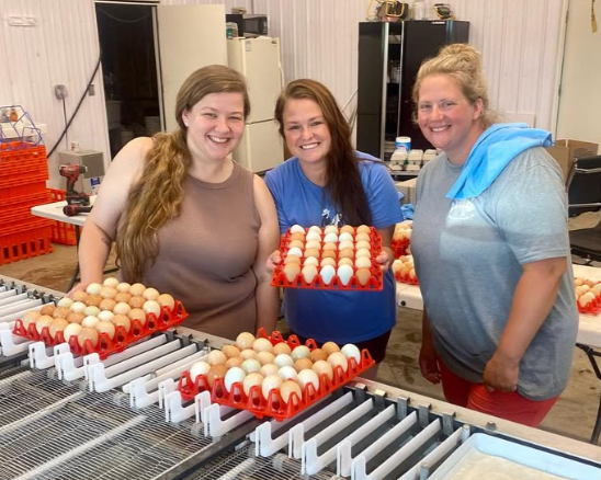 Three Women With Trays Of Eggs
