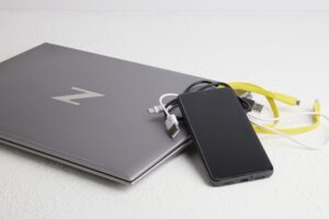 Laptop, Cell Phone, And Electronic Cords