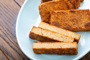 Crispy tofu slices in a blue bowl