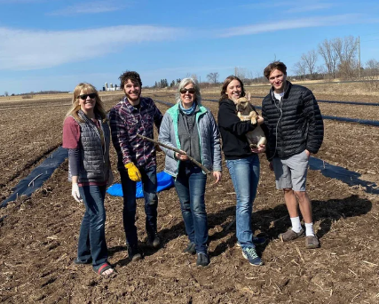 Family In Farm Field