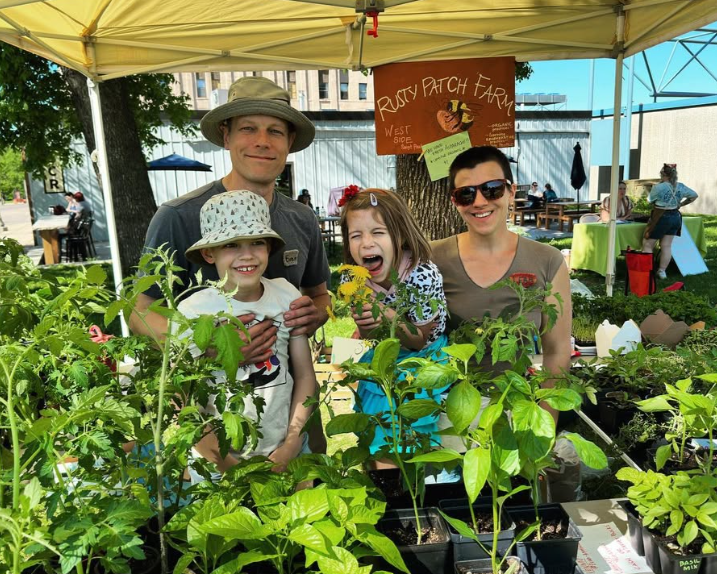 Family At Farmers Market Booth