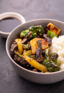 Teriyaki beef stir-fry in bowl with rice