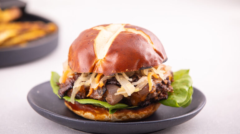 Burger Topped with Cheddar, Kimchi, Lettuce, on a Bun